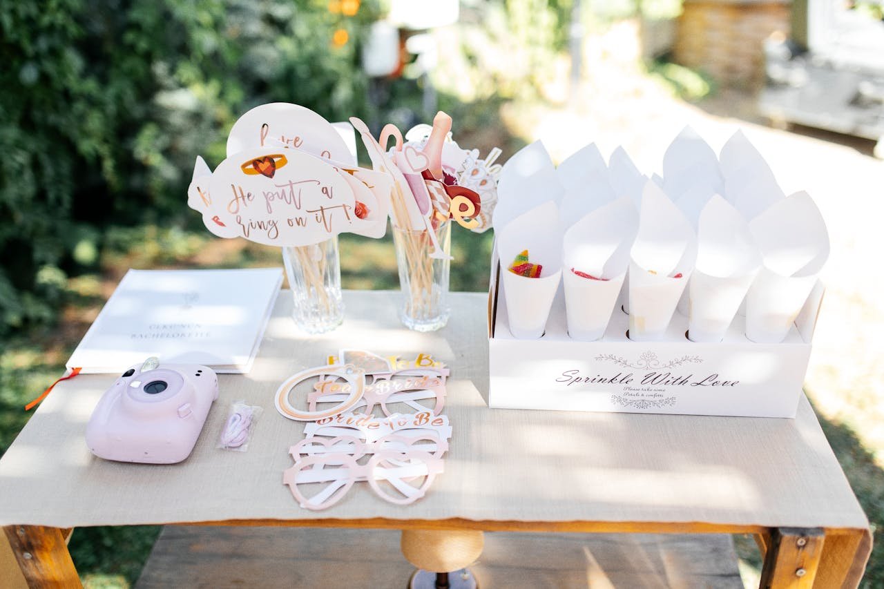 Charming outdoor setup with instant camera and festive decorations perfect for summer gatherings.